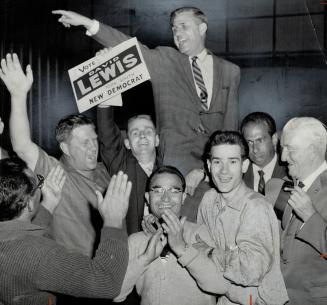 Jupilant NDP members carry David Lewis, the party's national vice-president, around Keelesdale arena after his win in York South where he defeated incumbent P