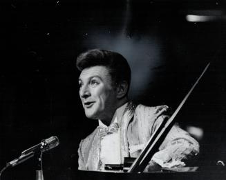 Liberace gives people 'A lot of simple pleasure'. He changed jackets three times, finally bringing the house down in one that lit up