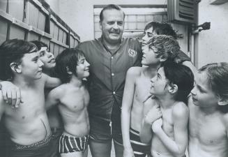 Still a hero: Cliff Lumsden is surrounded by admiring student swimmers in this 1973 picture taken at an Etobicoke pool