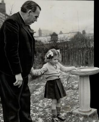New Governor of Newfoundland, Sir Gordon Macdonald is seen here with his granddaughter, Eryl Williams, in the garden of his home in Wigan, Lancs