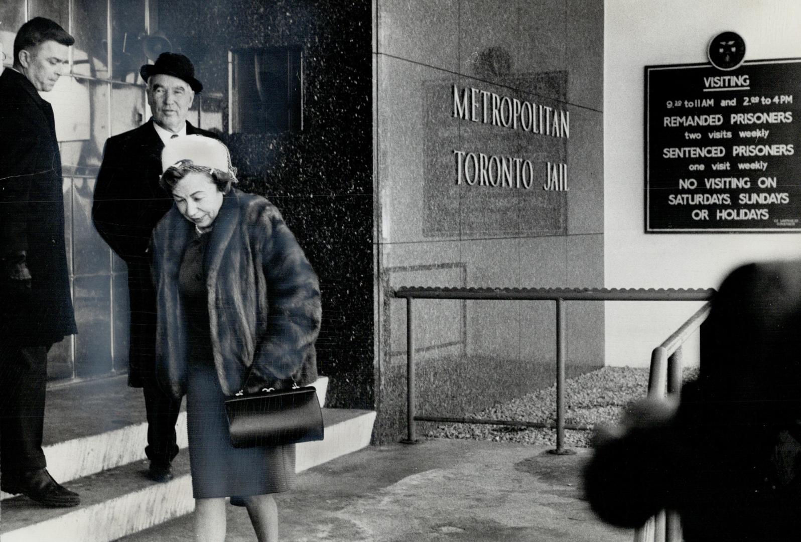 Accompanied by her husband, George, Viola MacMillan leaves the Don Jail