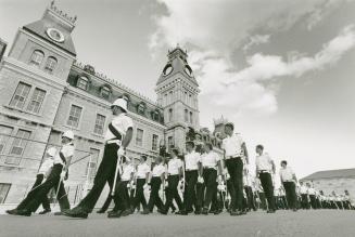 Military Precision: Cadet Wing Commander John Hatch, 21, above, and cadets in drill practice below, illustrate the military traditions at Kingston's Royal Military College