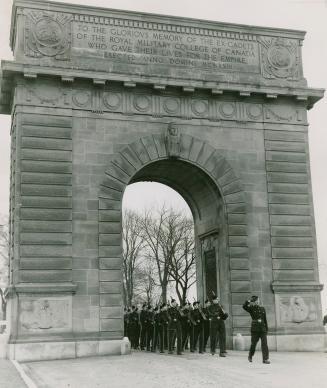 Memorial arch at the Royal Military College is framework for marching squad of cadets, the first class of the post-war training period at the Kingston school