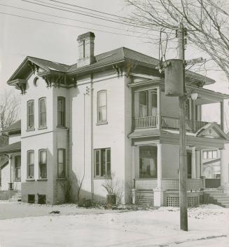 Old Detwiler home on Ahrens Street, Kitchener, where Mrs. Detweiler now lives in two rented rooms. Circumstances forced her to sell house in 1942.