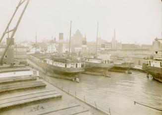 Image shows a few boats at the Harbor.