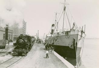 Image shows a ship at the warehouse wharf.
