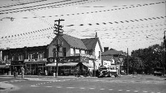 Yonge Street, northeast corner of Davisville Avenue. Image shows a number of stores located at  ...