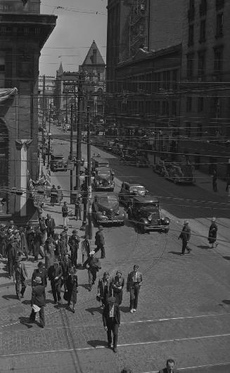 Queen Street East, looking east from Yonge Street, showing decorations for visit of George VI, possibly 22 May 1939, Toronto, Ontario