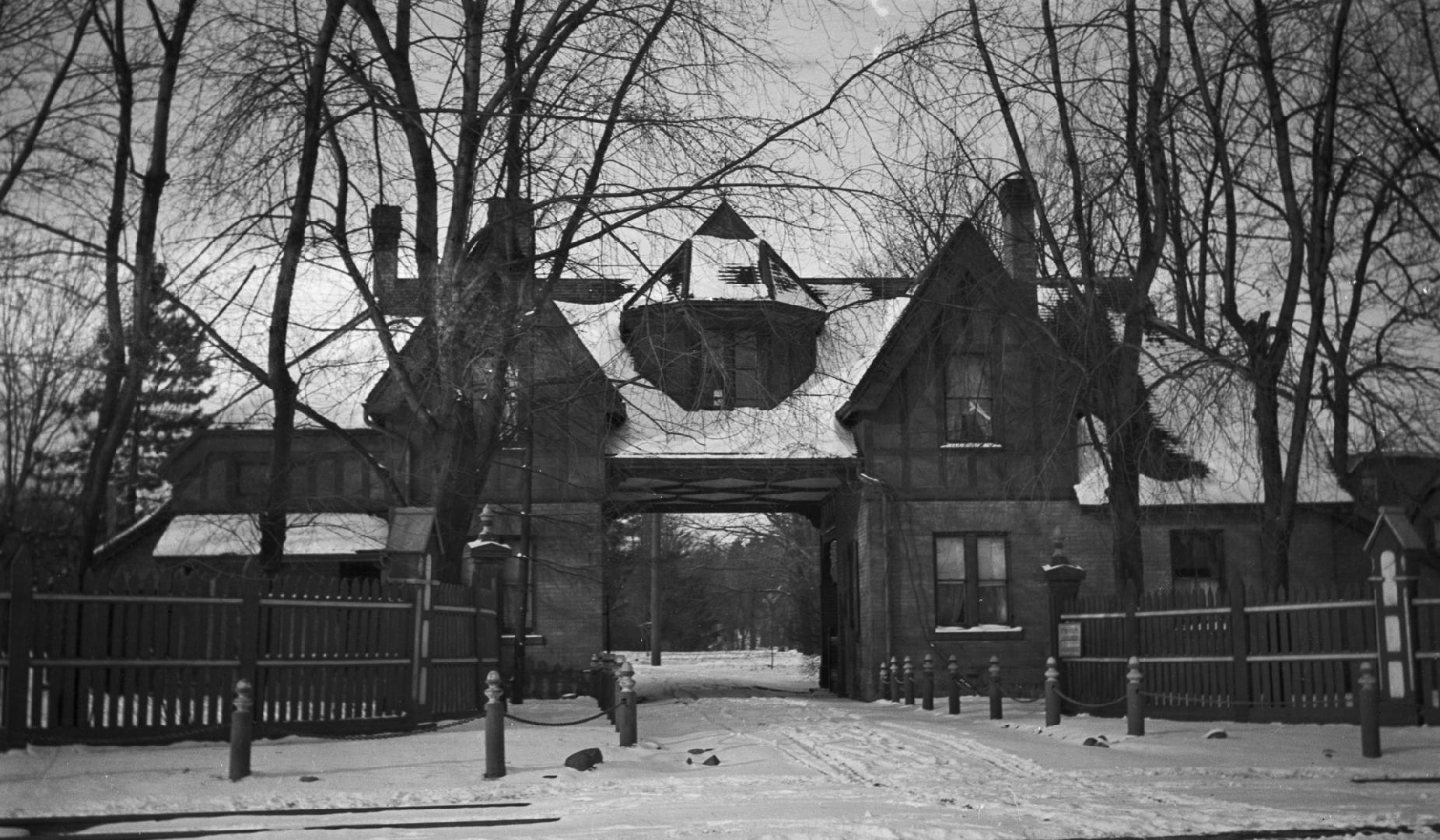 Image shows the front of a two storey house in winter.