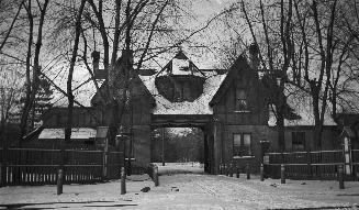 Image shows the front of a two storey house in winter.