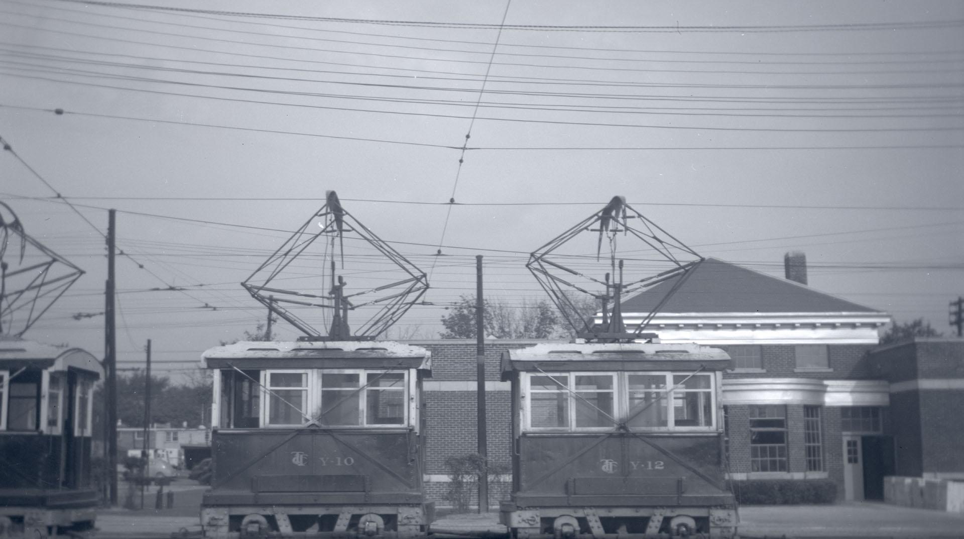 T.T.C., shunters at Eglinton carhouse. Image shows three work cars.