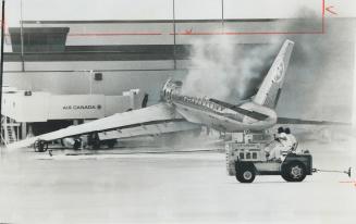 An air Canada DC-8 burns at Toronto International Airport last night after an explosion ignited jet fuel and turned it into a roaring fireball. Witnes(...)