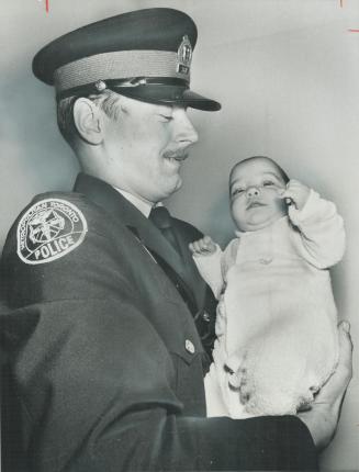 Alone in a smoke-filled apartment, 5-month-old Natalia Radosevic was saved by Constable Douglas Palmer, who swung Tarzan-style onto a balcony to reach(...)