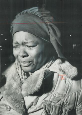 Homeless at Christmas. Crying, Monica Russell stands outside the burning apartment building on St. Clair Ave. W. at Atlas Ave. from which she, her hus(...)