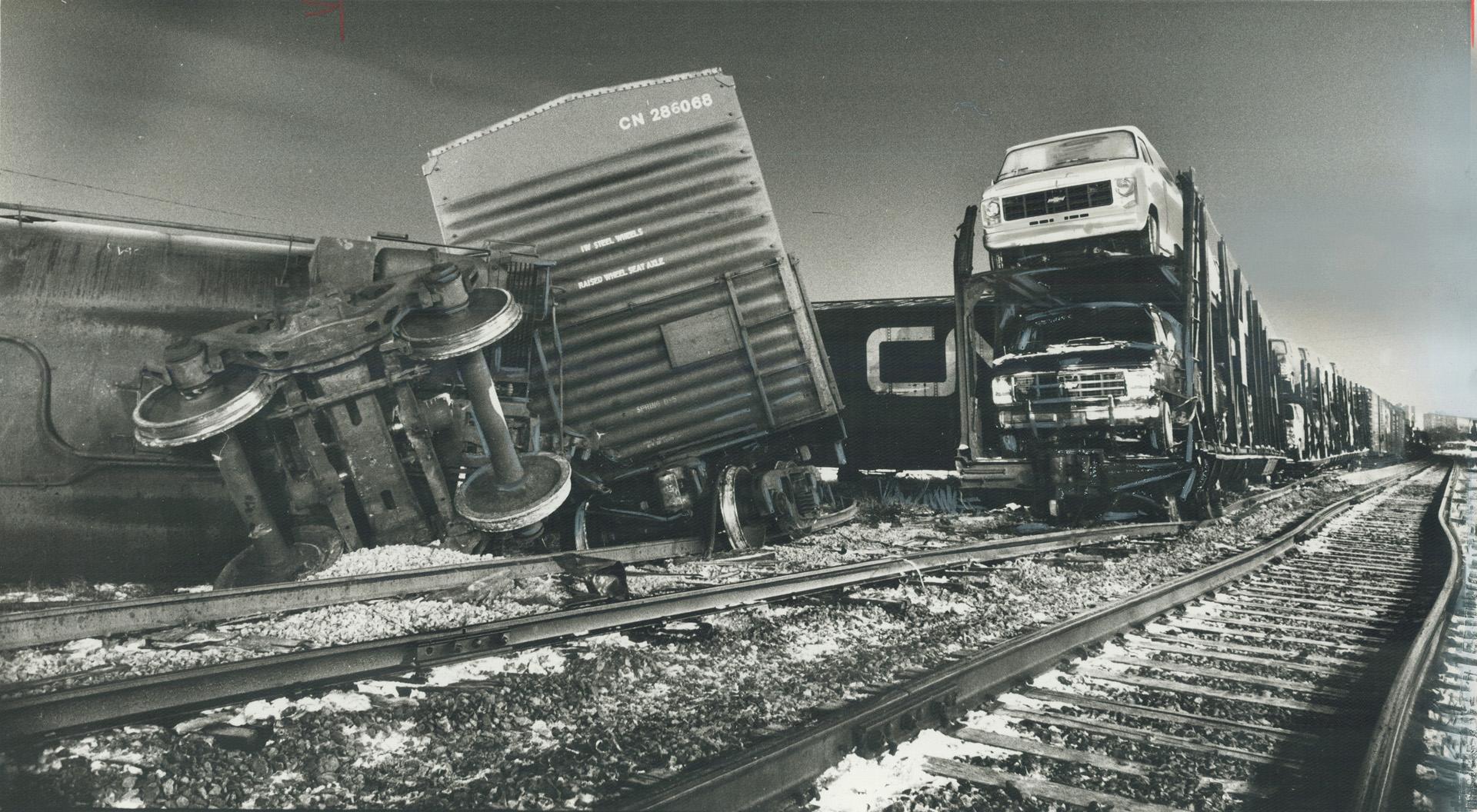 A close call. Eastbound GO train passengers were shaken last night when the engine of their train sideswiped one of eight derailed freight cars near W(...)