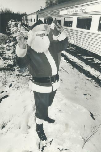 All aboard!: Santa Claus (left) was the star passenger among 2,000 kids who boarded Ontario Northland Railway's Santa Claus Express at Englehart Station yesterday