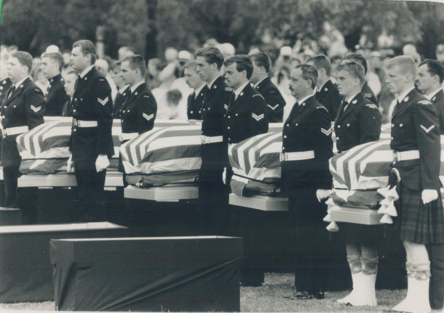 Military rites: A joint U.S.-Canada honor guard accompanies coffins containing the remains of 28 American soldiers killed on Canadian soil near Fort Erie during the War of 1812