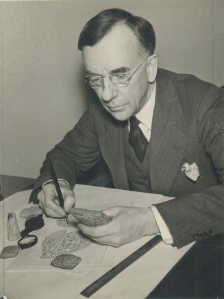 In his University of Toronto office, Dr. Theophile J. Meek
