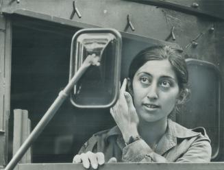 Julie Atalay, 17, checks her hair after two-mile hike