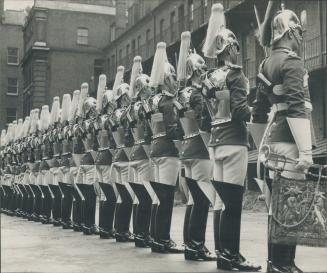 The Royal Horse Guards attend the King and Queen on such trips (below), the guards, affectionately nicknamed The Blues, are seen on inspection parade. [Incomplete]
