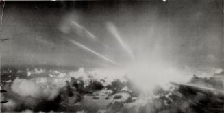 Blinding streamers of light accompanied the explosition of the first atomic bomb at Operation Crossroads in Bikini atoll. This photo, taken from the a(...)