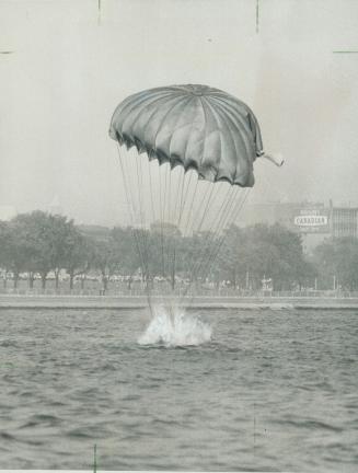 Wet reception greets jumper. After parachuting from plane over CNE waterfront