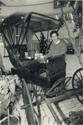 Hastings buggy: Ken Scott displays it at Scarborough city hall