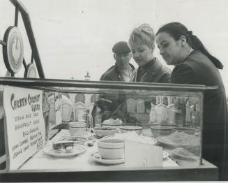 Expo visitors checking menu at burmese pavilion