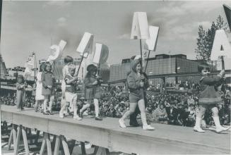 A slight mix-up in the letters spelling out Canada brought good-natured laughter from spectators watching these children parading outside the Canadian(...)