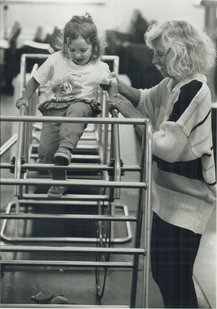 Monkeying around: Hartlee Zucker, 2 1/2, gets a hand at a Toronto Gymboree from her mother, Meryle, who calls the club much better than a playground