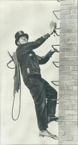 Heights hold no terror for chimney sweep Norman Lenz seen sealing a chimney stop a Toronto apartment building