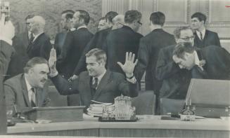 Gesture of mock surrender is made by Justice Minister John Turner as he holds his arms high in the air during lighthearted exhange with Ontario Premie(...)
