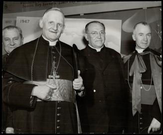 Cardinal Gerlier, Archbishop of Lyons, France, is shown with other church dignitaries at the University of Ottawa when James Cardinal McGuigan was giv(...)