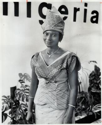 Traditional Nigerian dress and jewelry were worn by Mrs