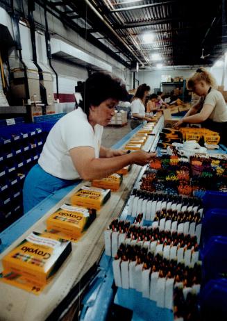 Wax workers: Joanne Dorgan, left, and her shift mates are among the 160 Binney and Smith employees working to meet the surge in demand for crayons