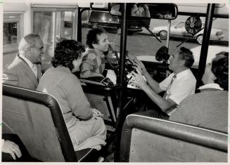 At the wheel: John Mangioni, left, listens as instructor Al Taylor reviews material he and other student school bus drivers have been learning