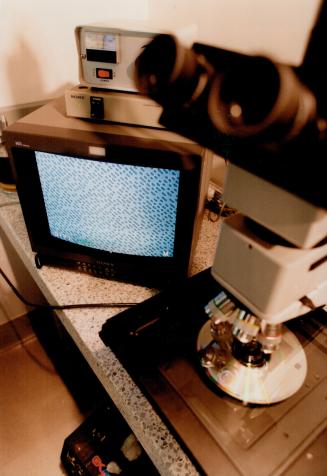 The Pits: Microscopic pits on a stamper are magnified and displayed on a television monitor for inspection at the Sony Music plant in Toronto