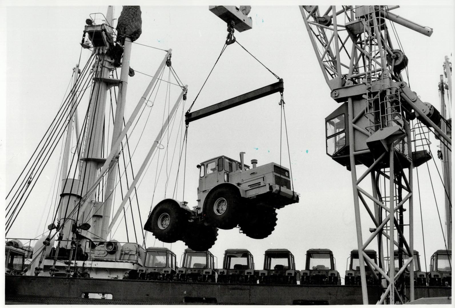 Pix of Russian Ship (Dockas this morning) Stanislavskiy Unloading Tractors for Canadian Consumption
