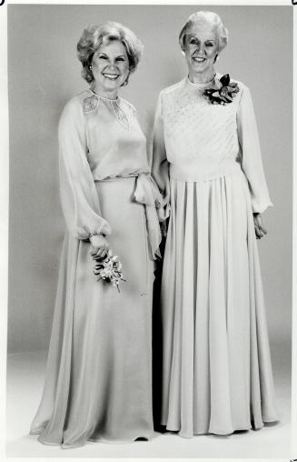 Delicate detail: Above left, the groom's mother wears Nuna Barron's hyacinth blue chiffon dress with net inserts and beading on a matching chiffon overblouse