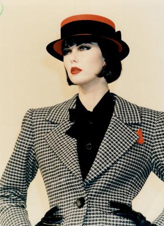 Tweed jacket: Black and white tweed jacket from Yves Saint Laurent with wide notched lapels, fitted waist