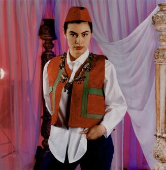 Left, embroidered vest, $32, and jeans, $18, Screenplay, white cotton shirt, $175, Loucas Kleanthous for European Star Knitwear, fez and antique Indian necklace, Screeplay