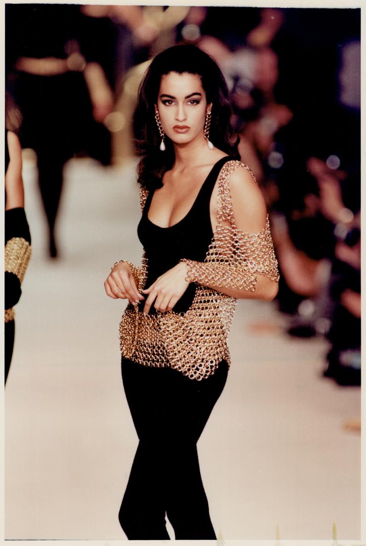 Left, body suit with gold mesh wrap was designed by Karl Lagerfeld