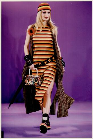 Stripes forever: Above, Anna Sui's nouvelle hippie wears striped tank dress with slits, slashed maxi vest, knit cap and chunky accessories