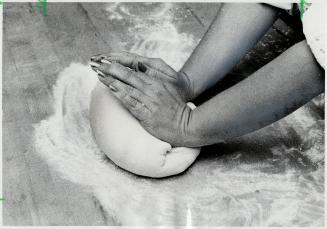 Kneading the dough with two hands, Use the heels of hands to push dough, turn, push again