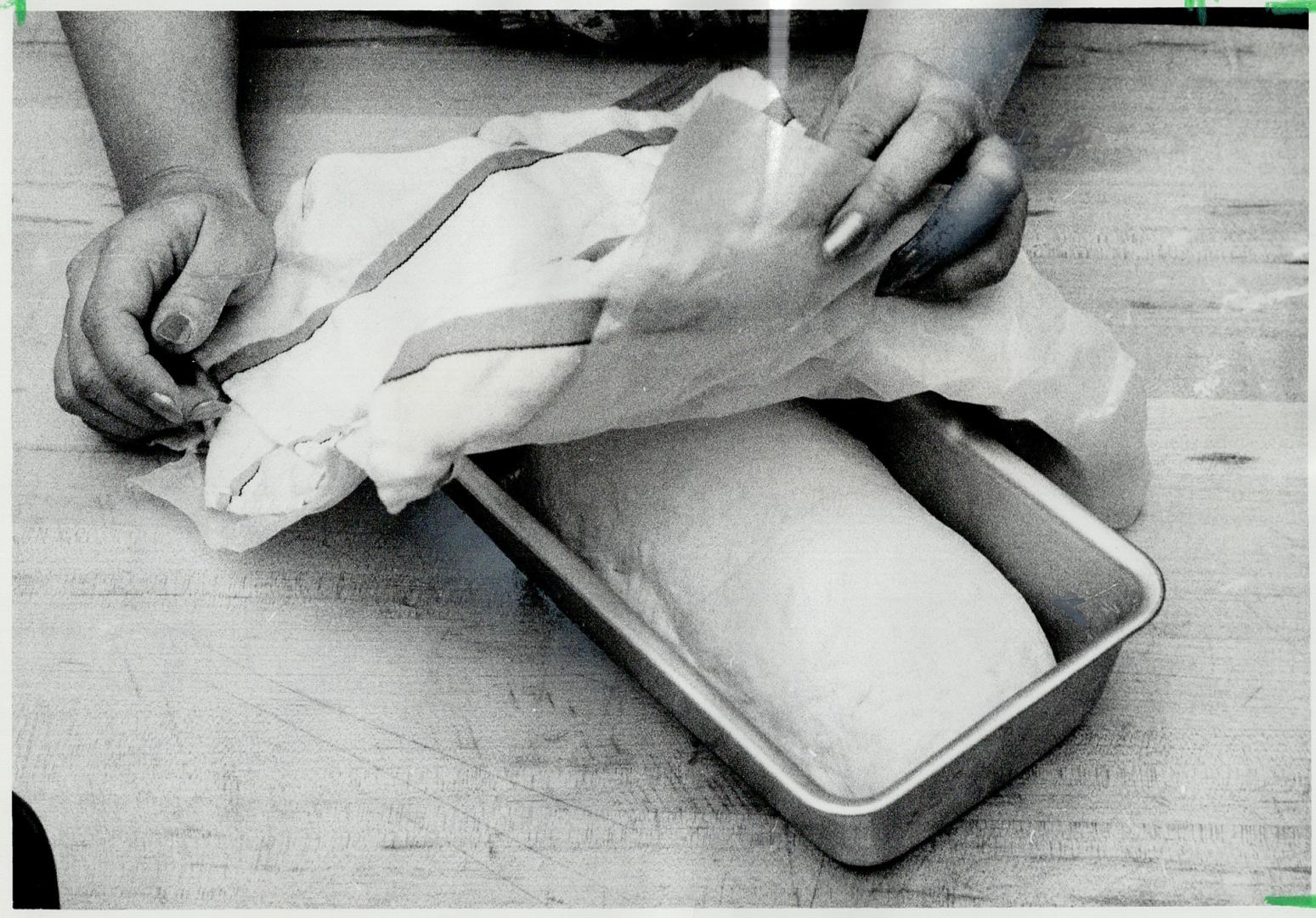 Roll goes in Greased pan, Cover it with wax paper, damp cloth