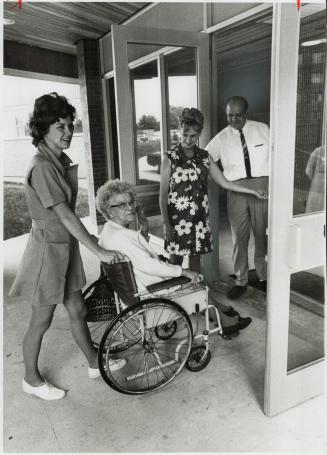Lucy Grant, 75, is wheeled inside by Kathy Crooks