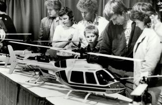 Spectators look at model aircraft yesterday at the Hobby Show at the International Centre