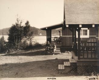 Nipigon 10928 [men on steps of cabin]