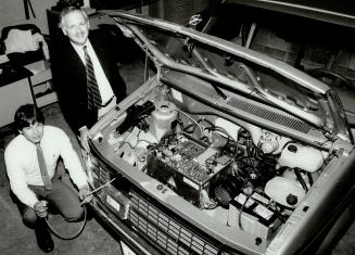 Where's engine? Gary Benninger (standing) and Earl Hughson of Powerplex show radical sulphur-sodium battery
