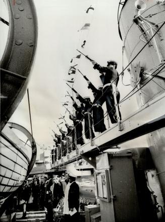Salute to the Navy's Dead, Rifles sound a salute during The Last Post in the naval remembrance service yesterday at HMCS Haida, moored at Ontario Plac(...)